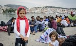 Newly arrived refugees wait to be registered in Mytilini harbour,&nbsp;Lesbos